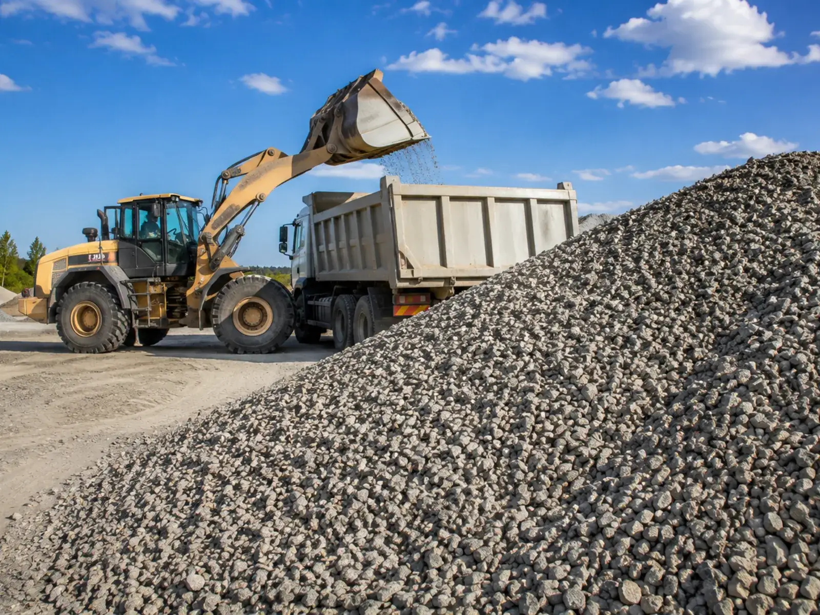 Operator compacting Class 2 Road Base for a level pad before asphalt installation